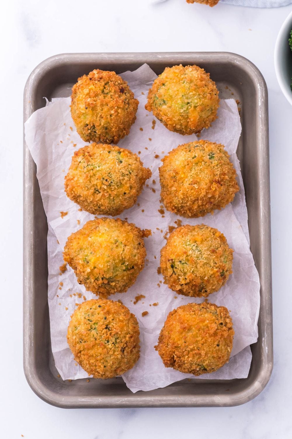 overhead view of broccoli bites in pan