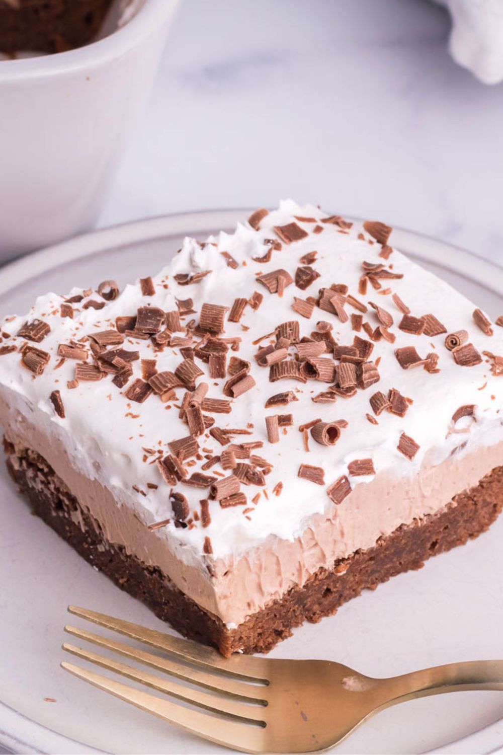 slice of French silk brownies on table with a fork in front