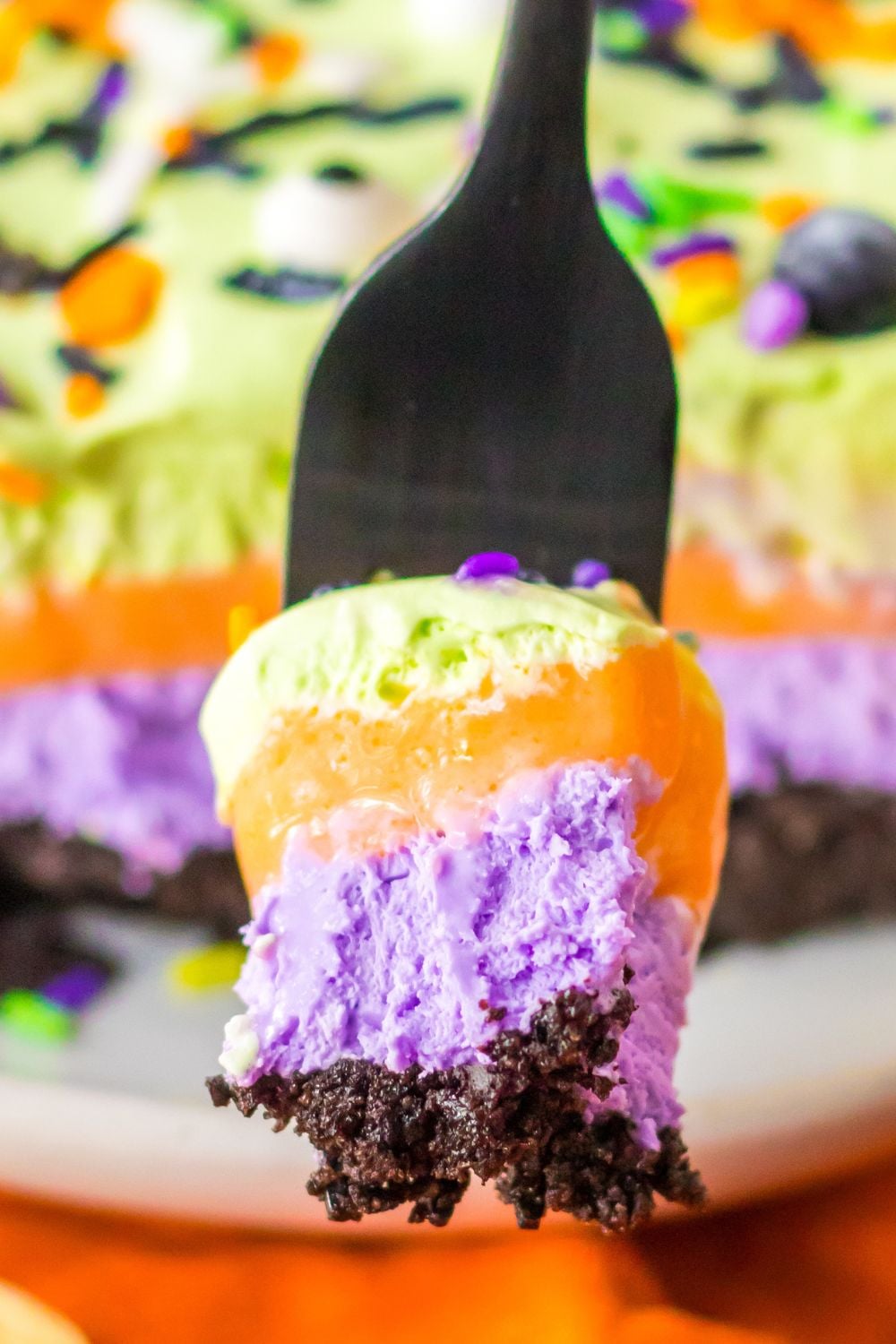 fork with lush layered dessert on it
