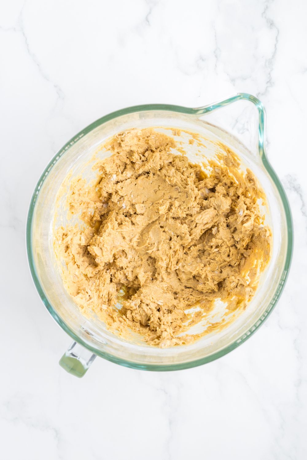 blended cookie batter in a measuring cup