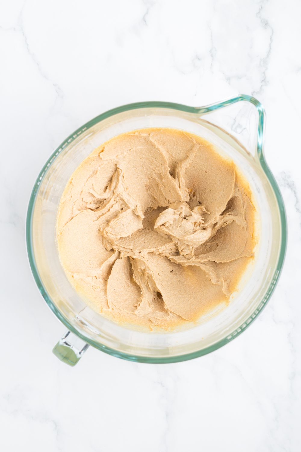 creamed butter and sugar in a measuring cup