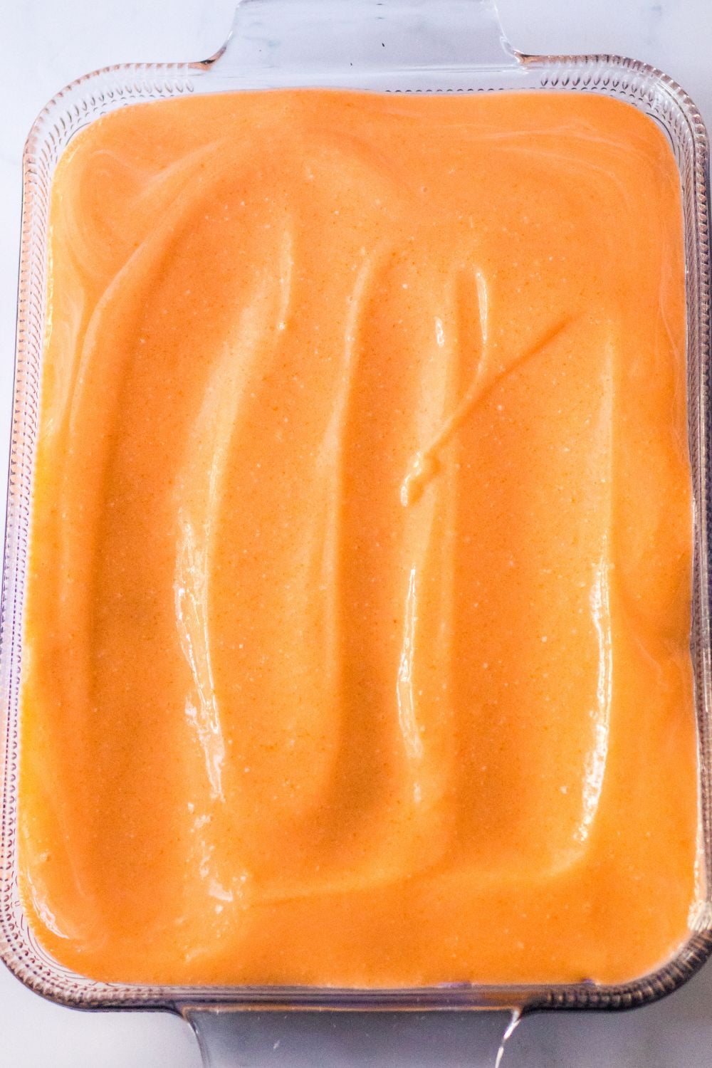 orange layer of jello mixture on bars 