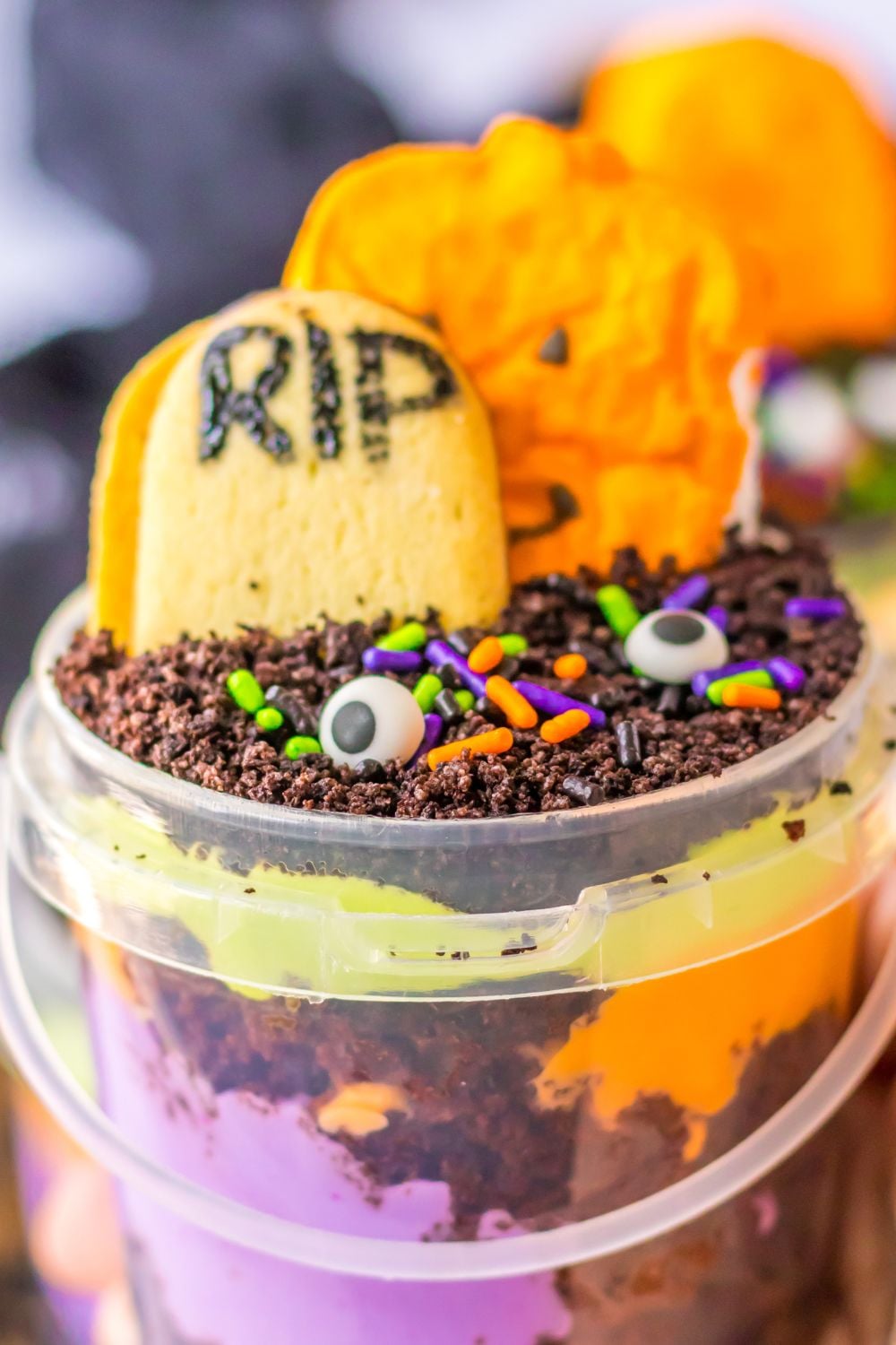 view of halloween pudding cup in hand close up view