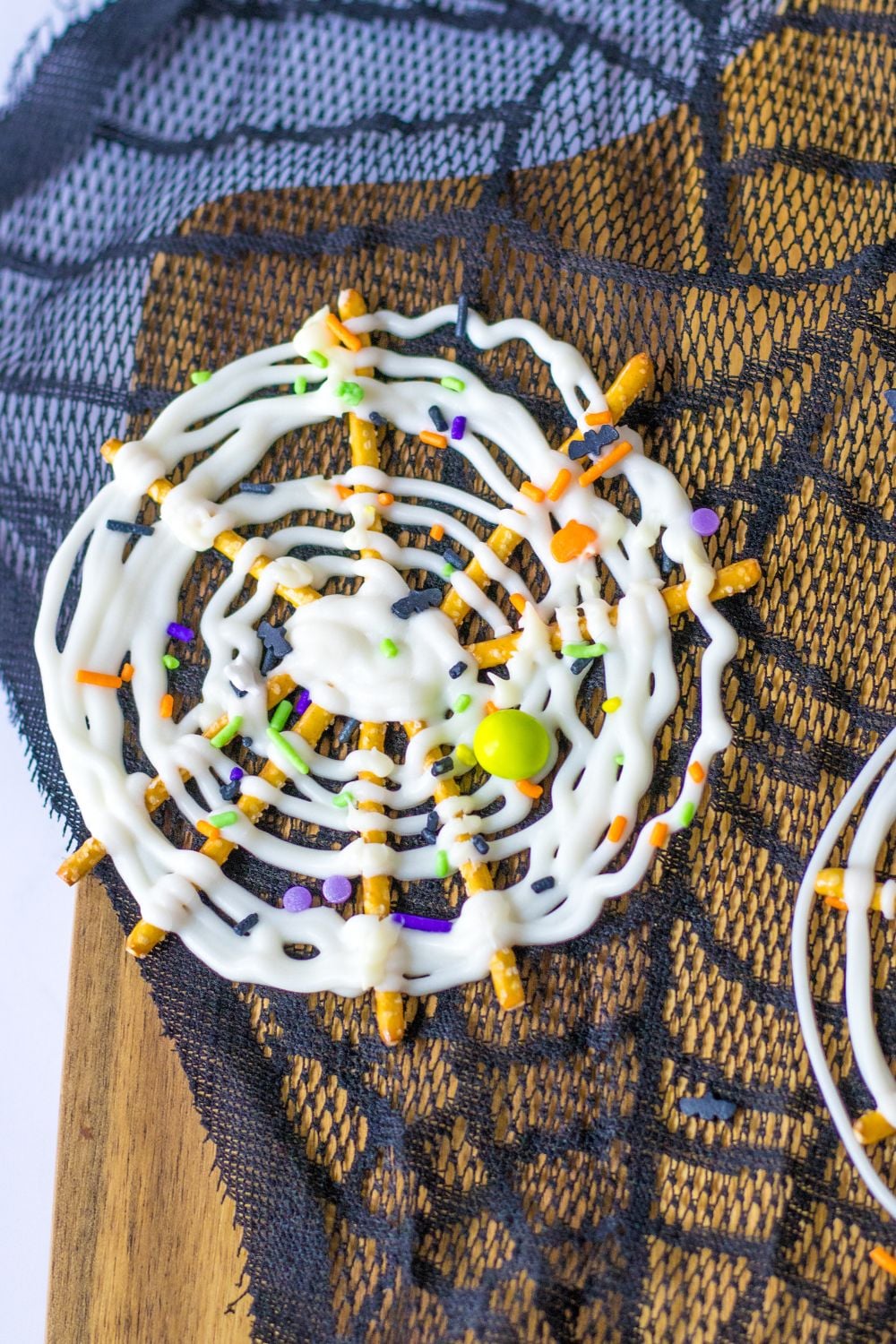 web pretzels on table with a lace background