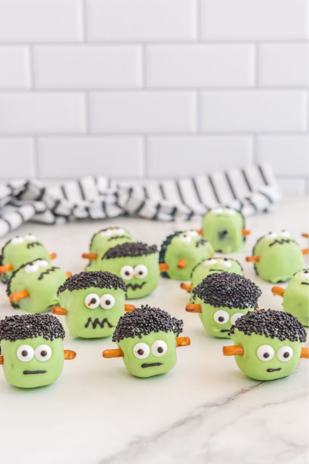 halloween oreo balls designed to look like frankenstein on table