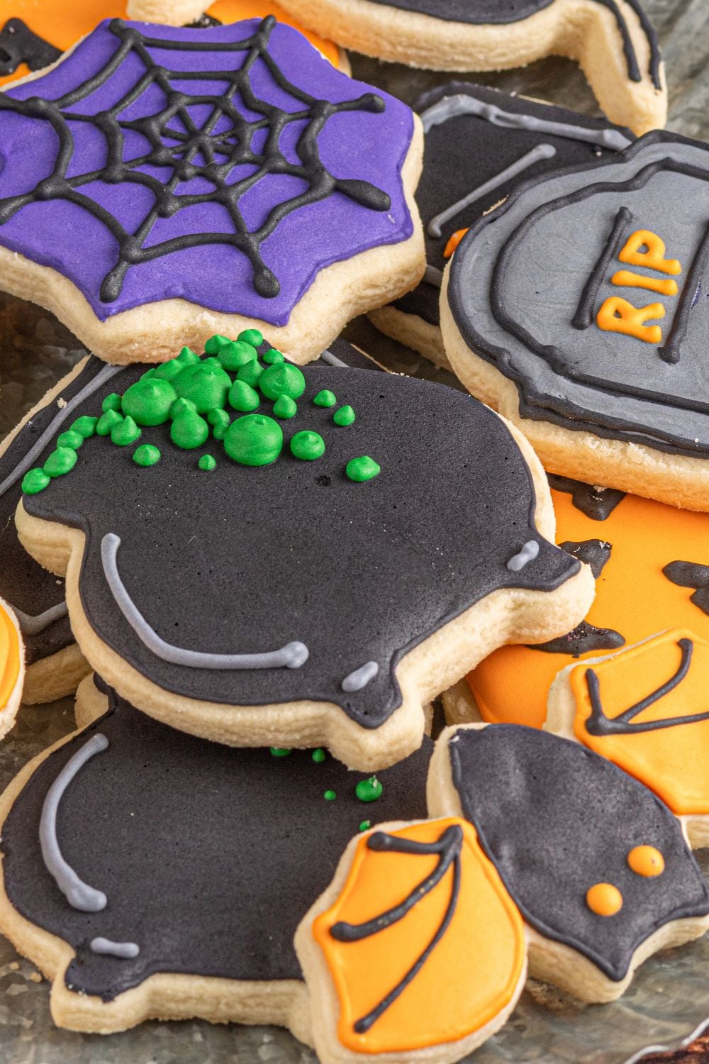 stack of halloween themed cookies on a tray