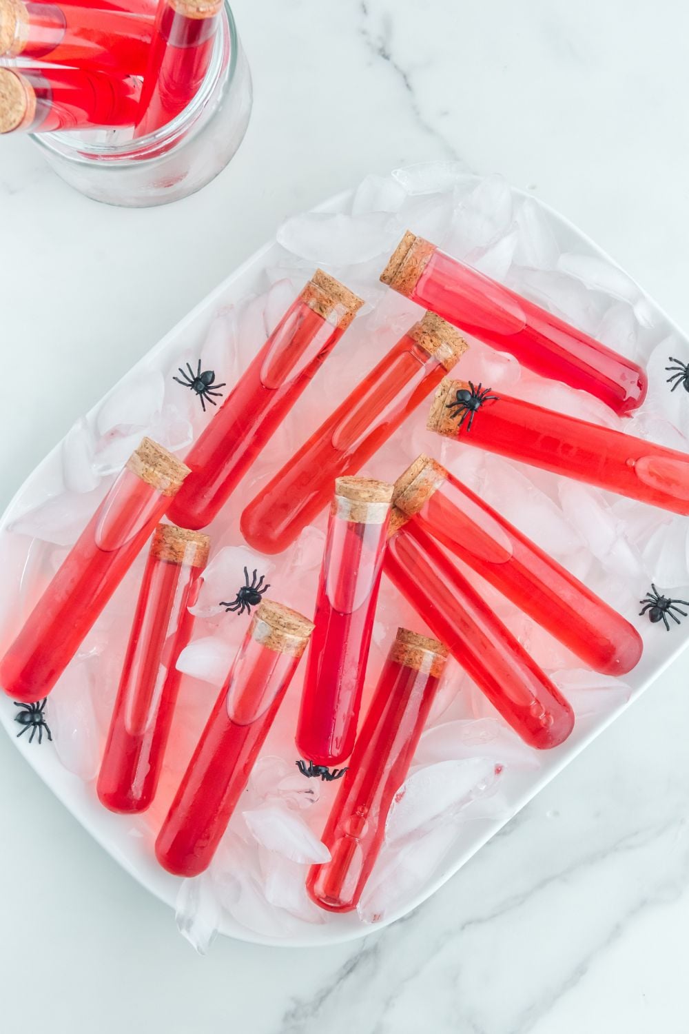halloween shots in test tubes on the table with ice on a tray to keep cold