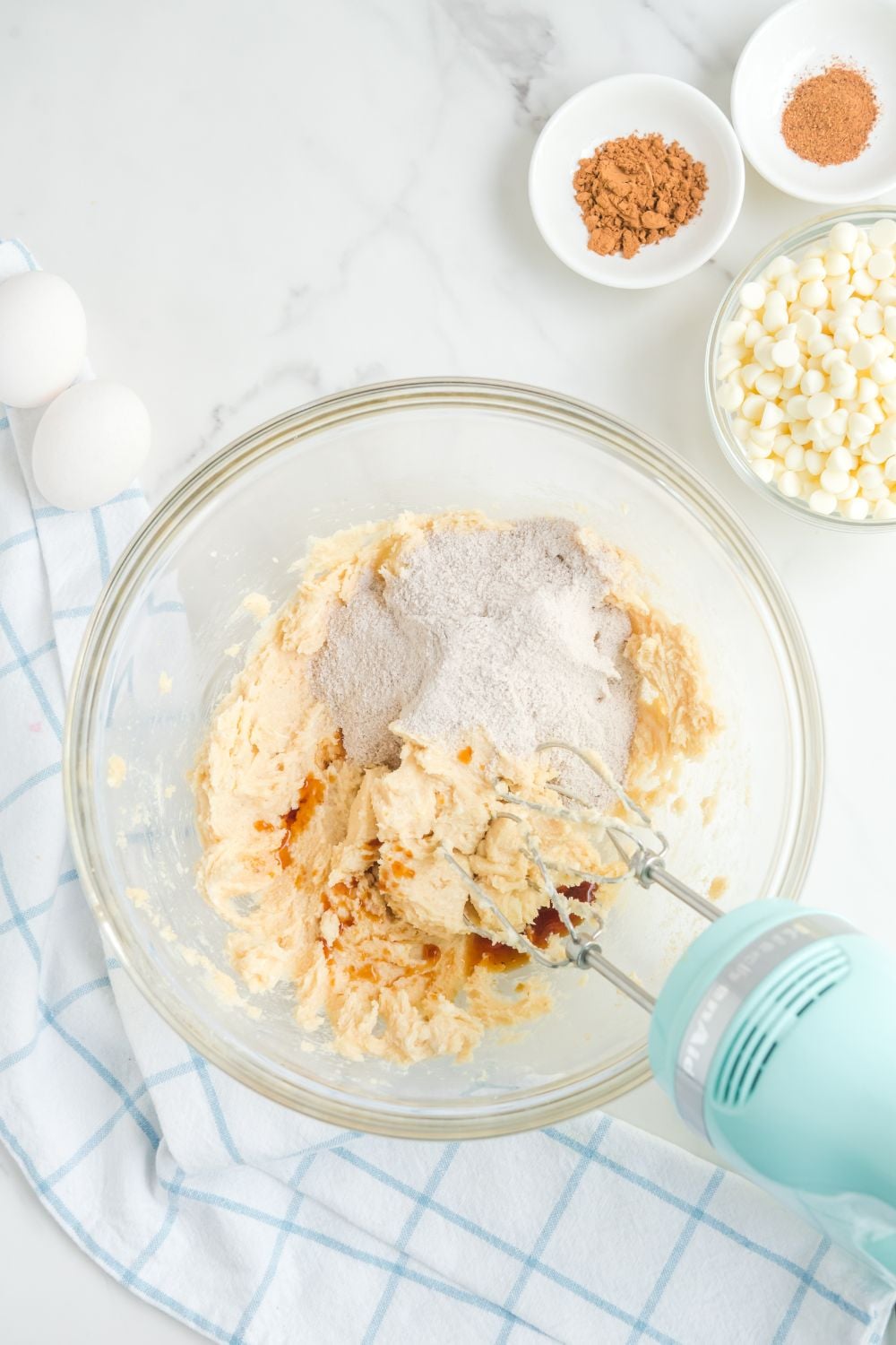 ingredients for cookies mixing in a glass bowl
