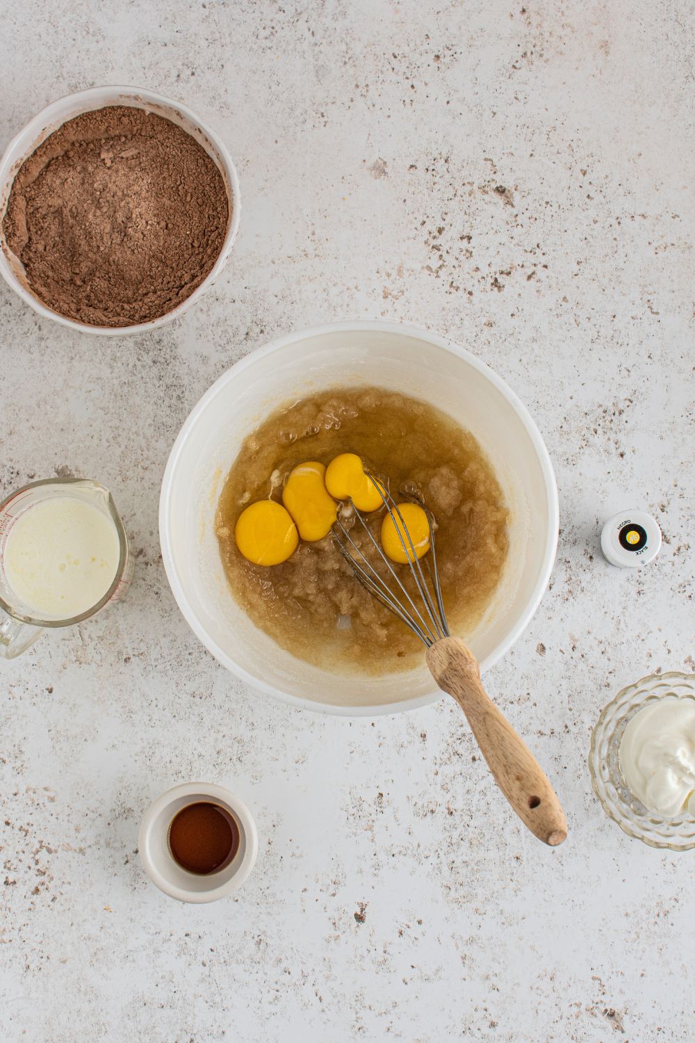 eggs and wet batter in a mixing bowl
