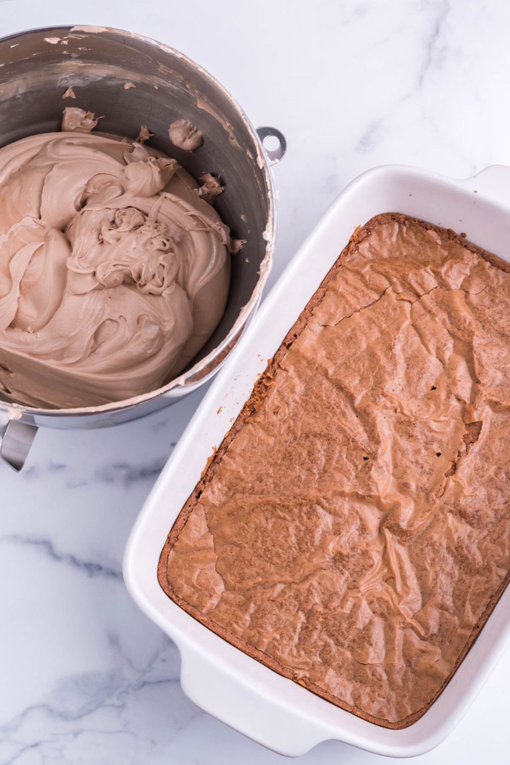 brownies baked in pan with french silk pie mixturein a bowl on the side 