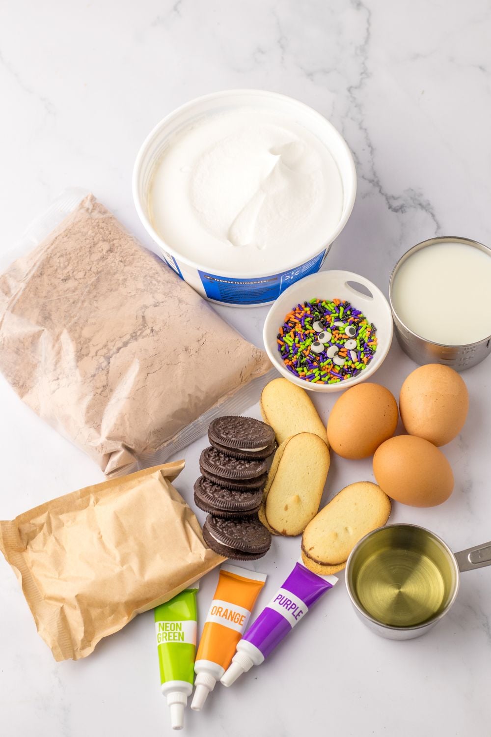 ingredients for halloween pudding cups on table