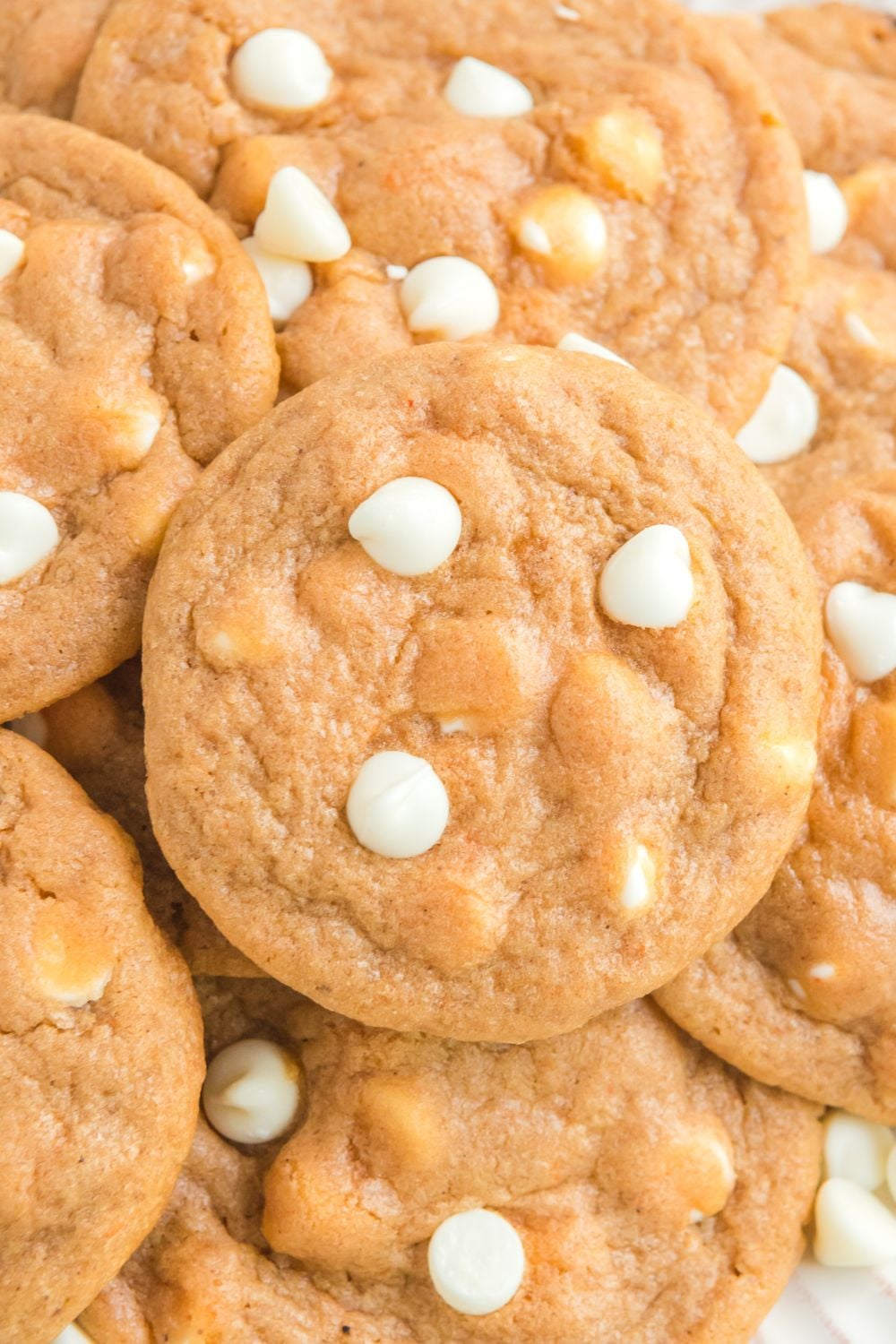 pumpkin spice cookies stacked on top of each other on a plate