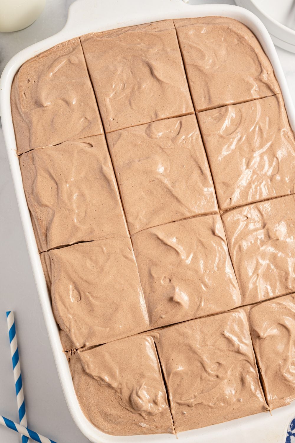 Italian cake in pan on table sliced into squares 