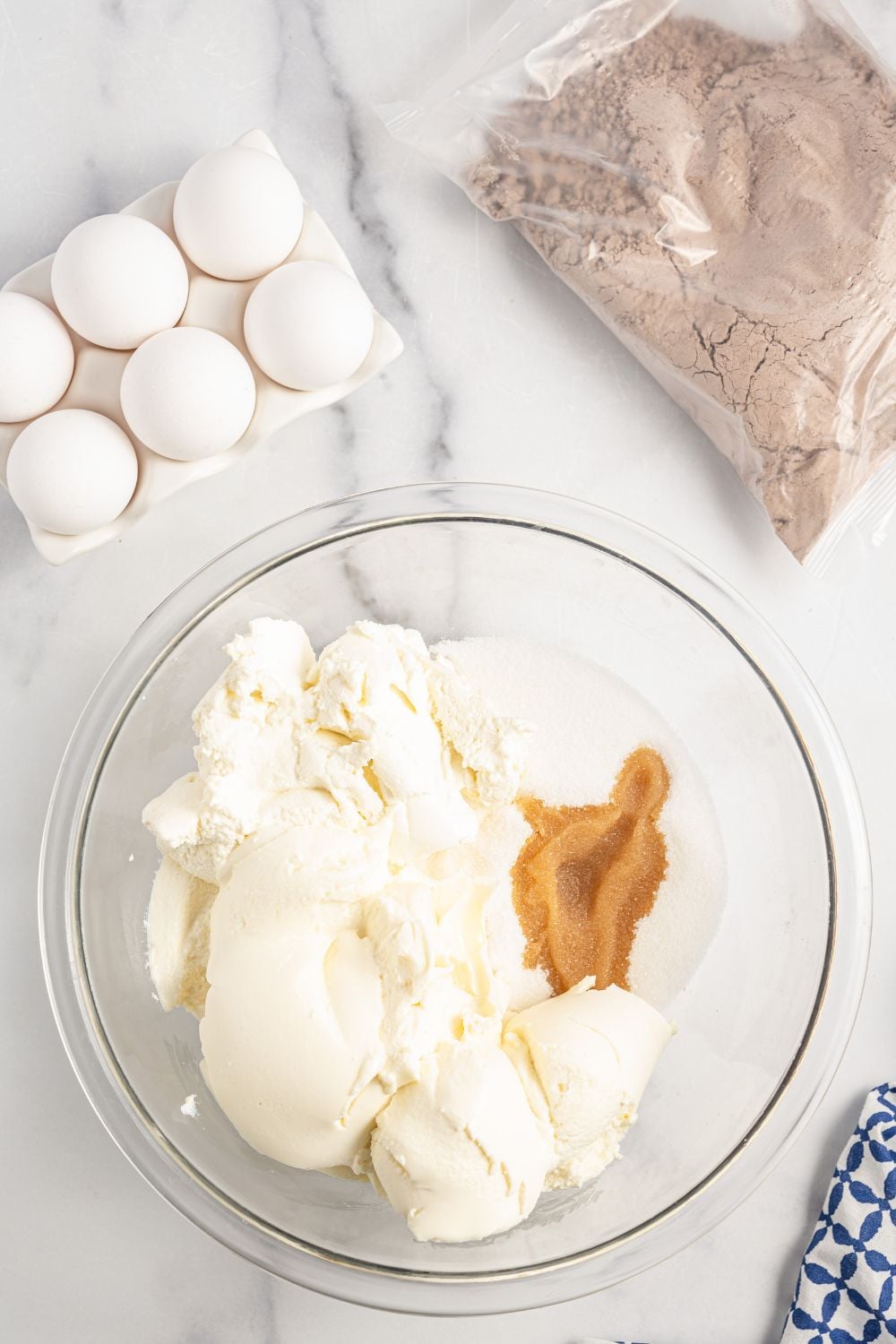 ingredients in a glass bowl for a love cake