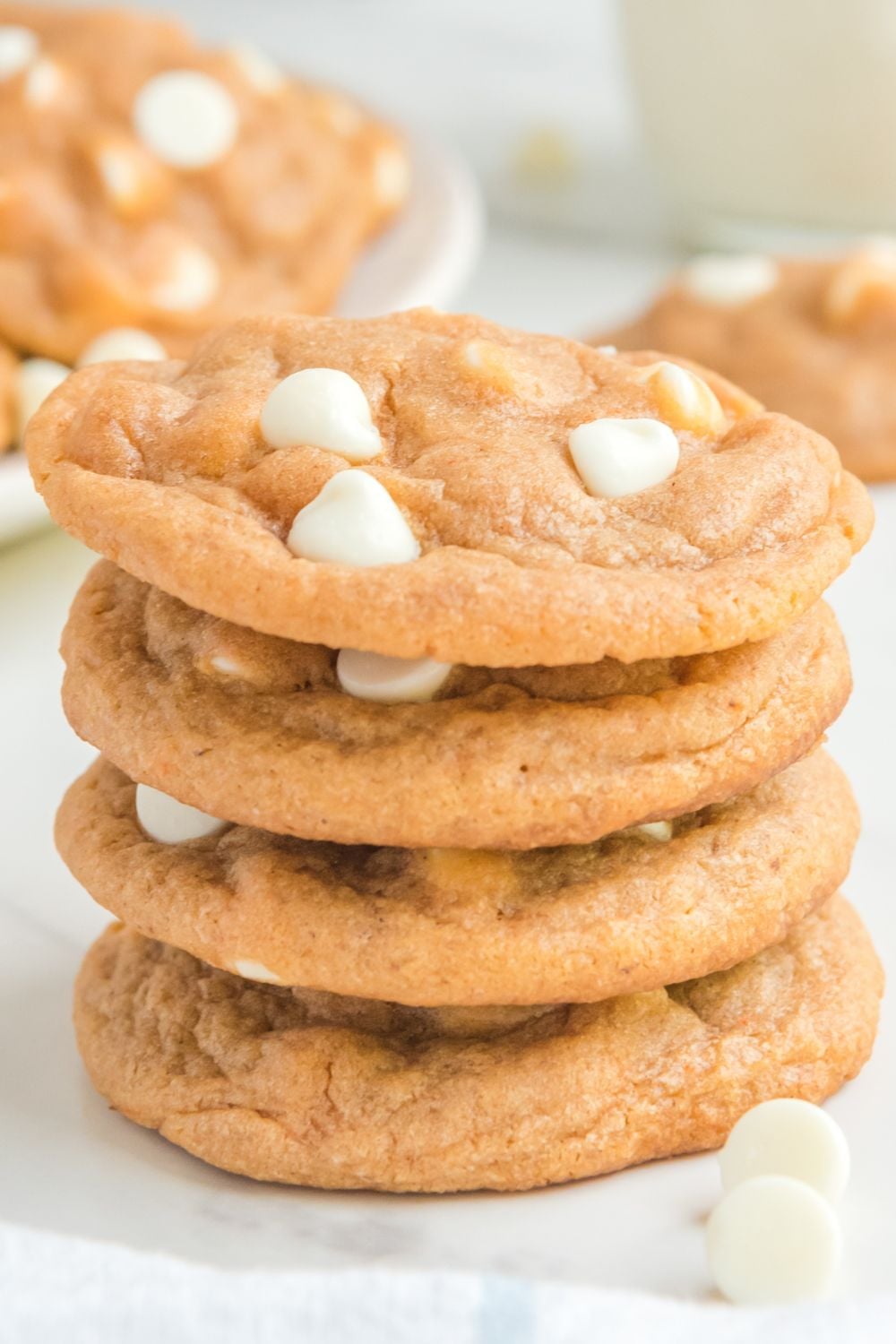 stacked pumpkin cookies on table