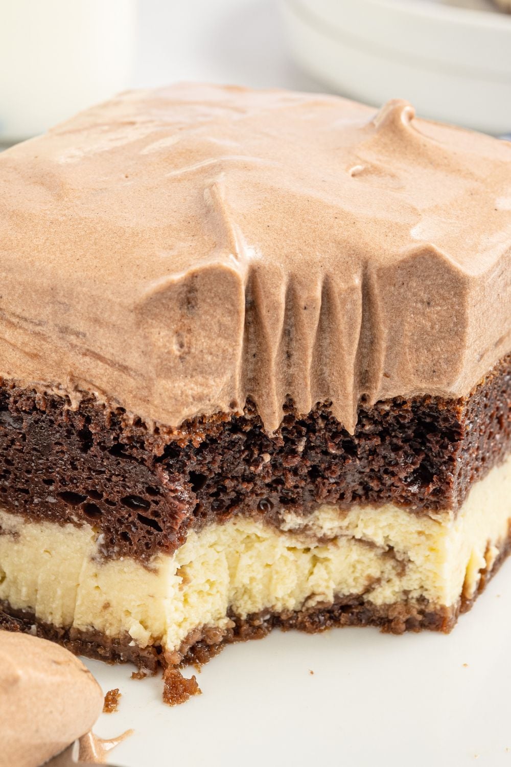 Italian Love Cake sliced cake on plate with fork bite taken out 