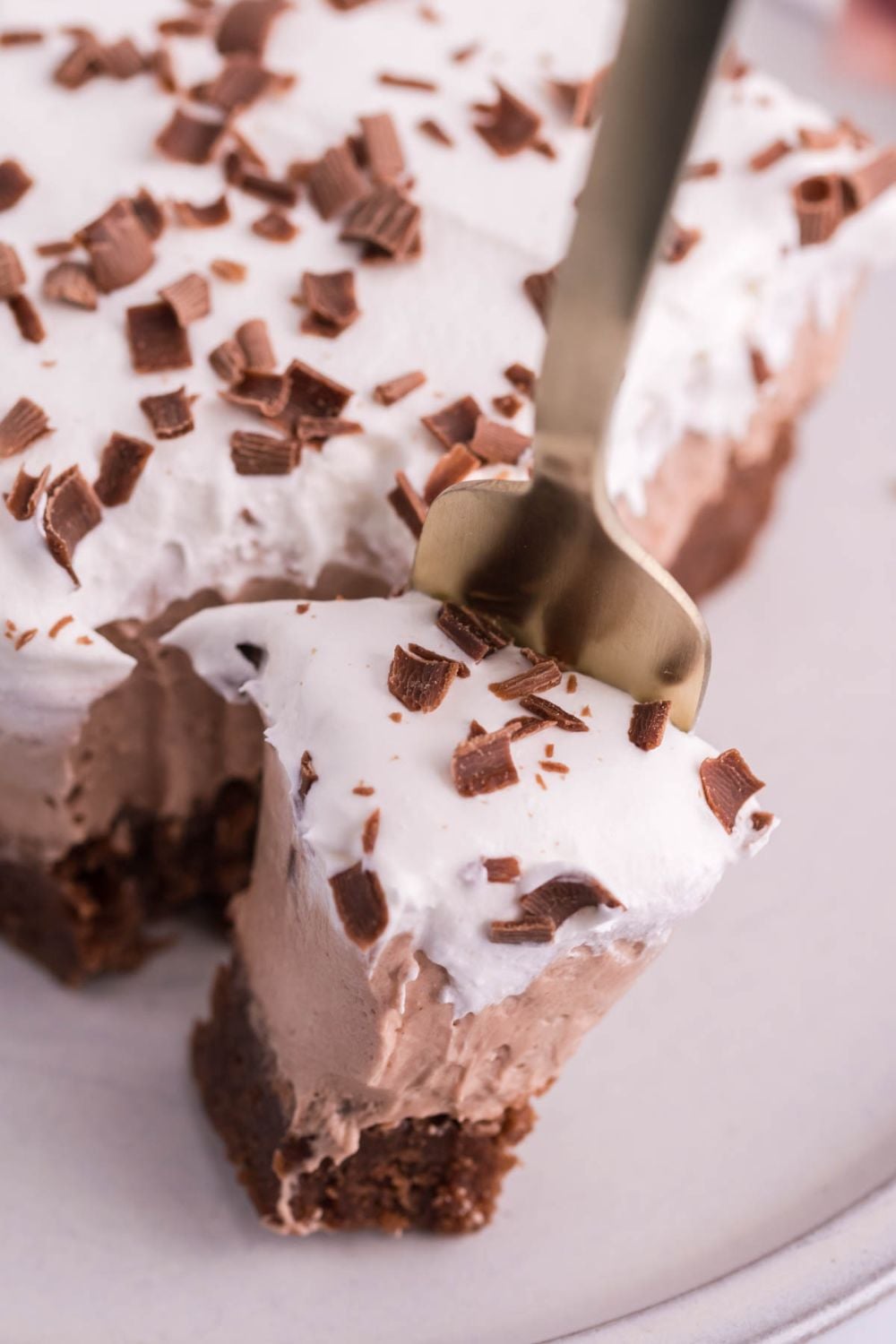 fork with a bite of French silk brownie on it