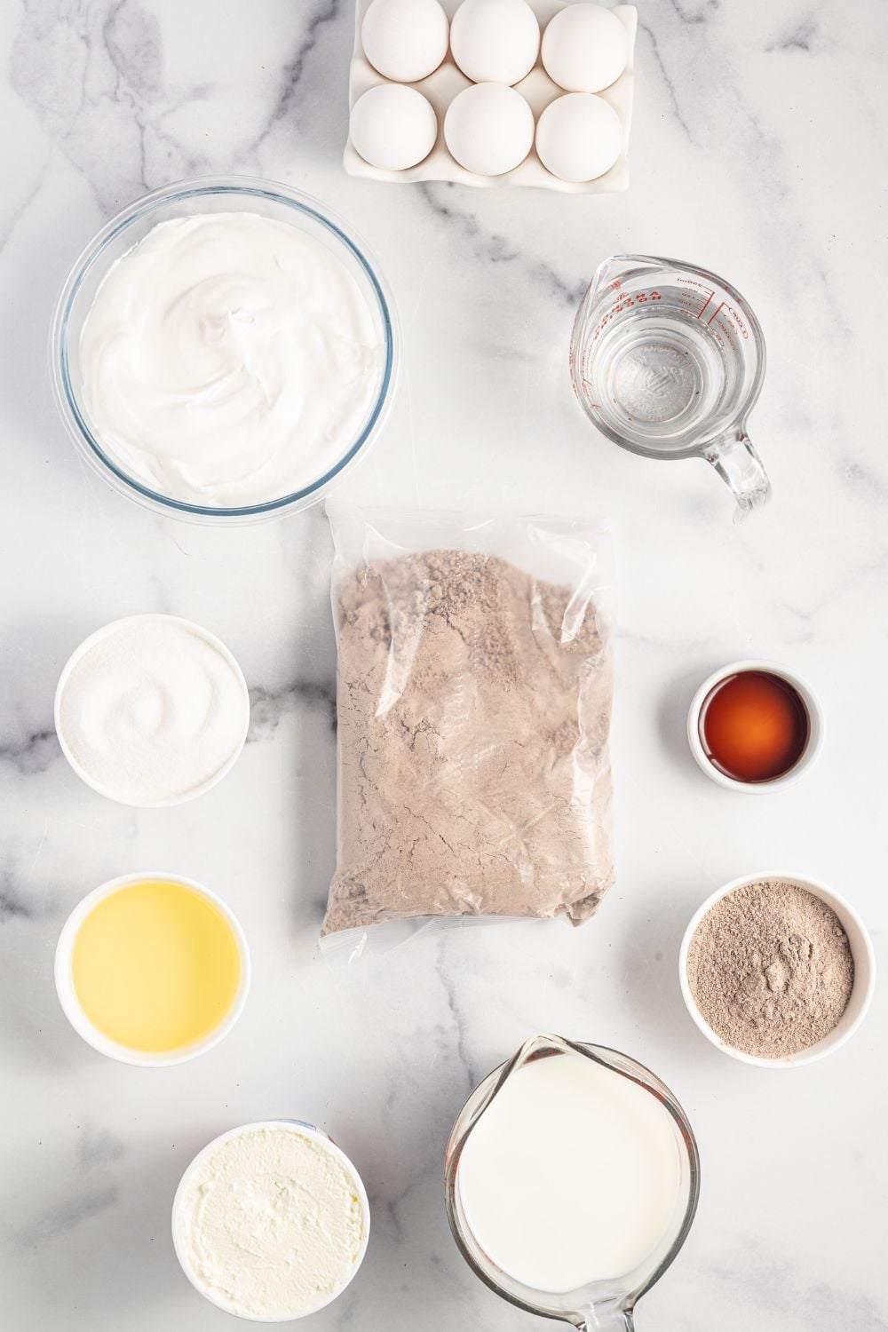 ingredients for love cake on a marble counter