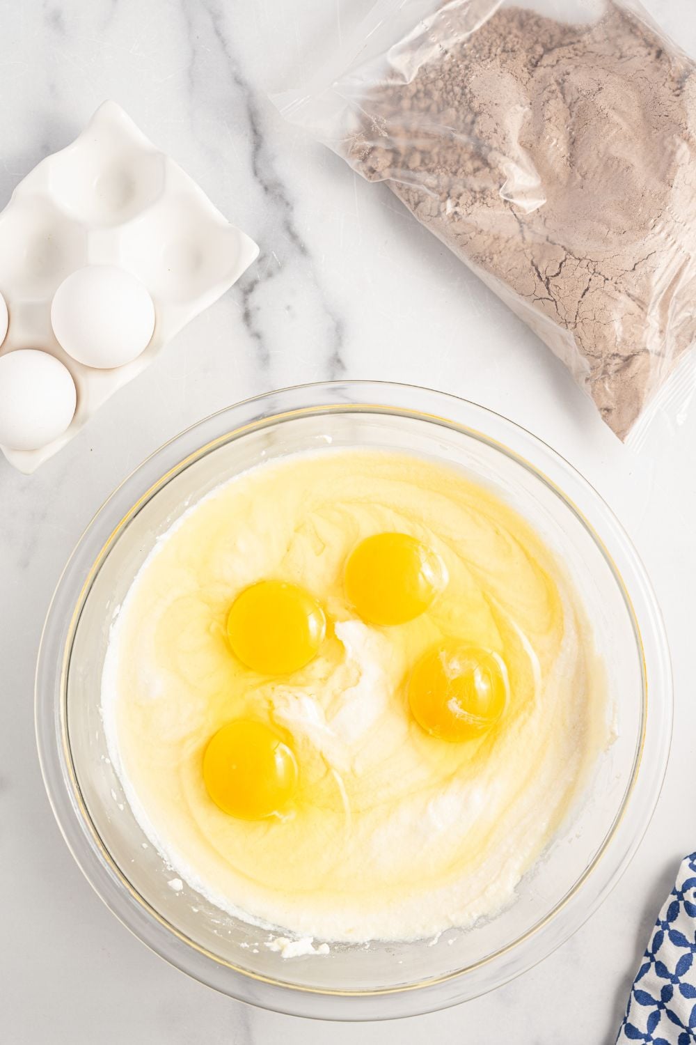 eggs in ricotta mixture in a glass bowl 