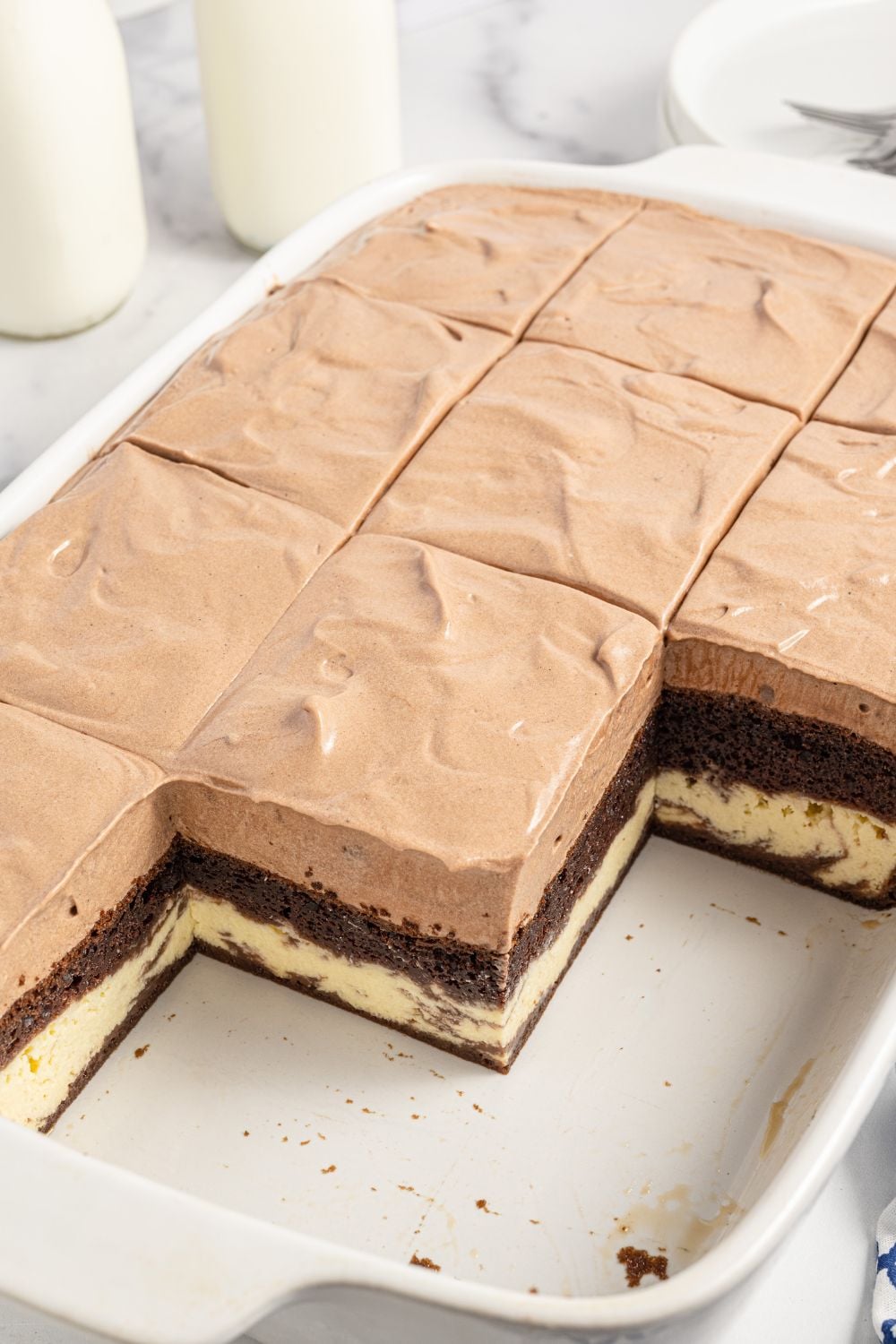 love cake in pan with pieces of cake removed