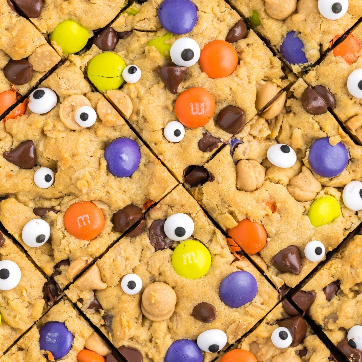 Halloween Monster Cookie Bars sliced and overhead shot of them in pan