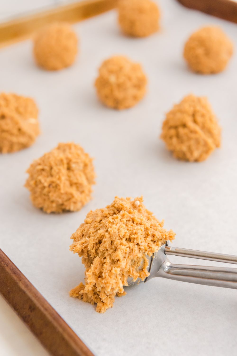 cookie scoop with cheesecake batter on it 