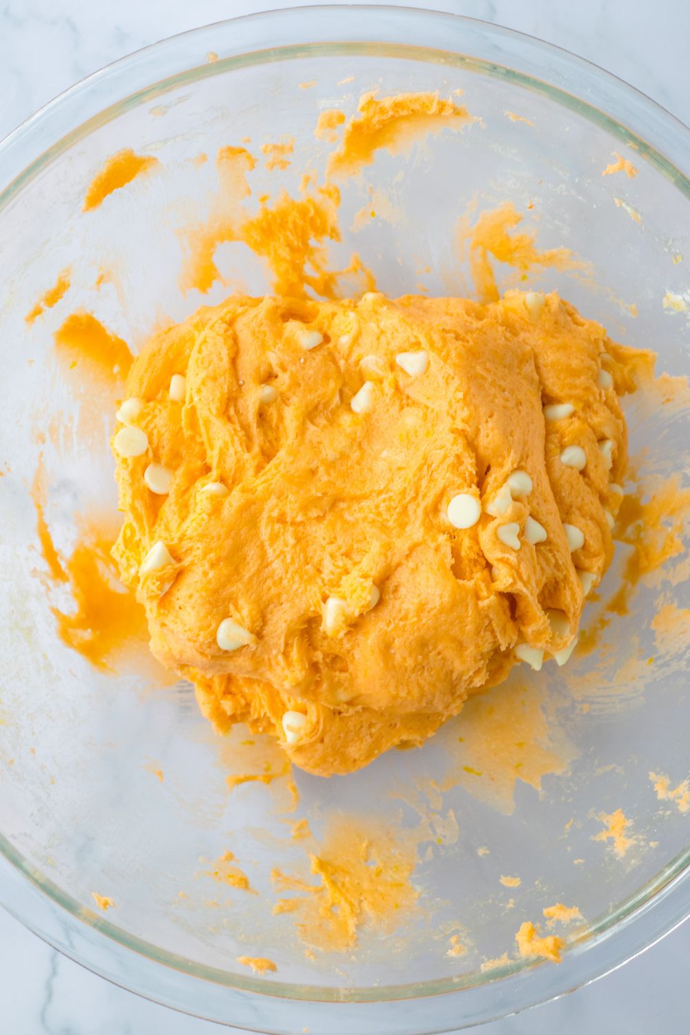 cookie batter creamed together in a glass bowl 