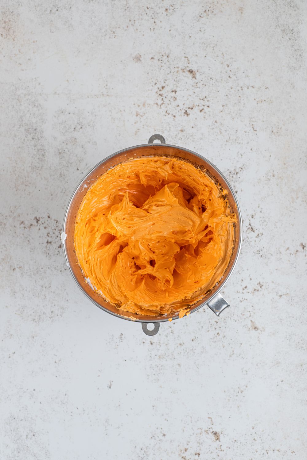orange marshmallow fluff in a container