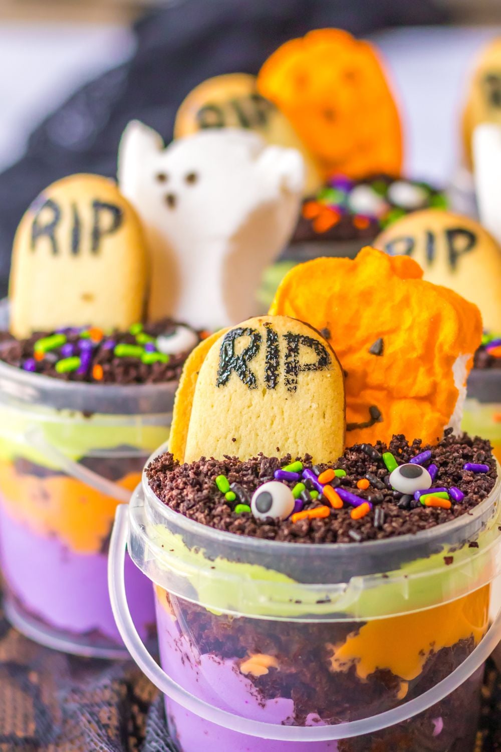 halloween buckets on table with candies decorated