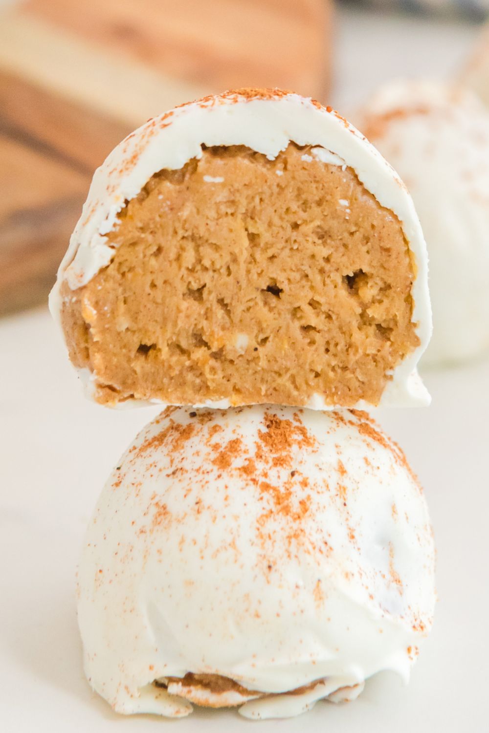 pumpkin balls stacked on top of each other on table