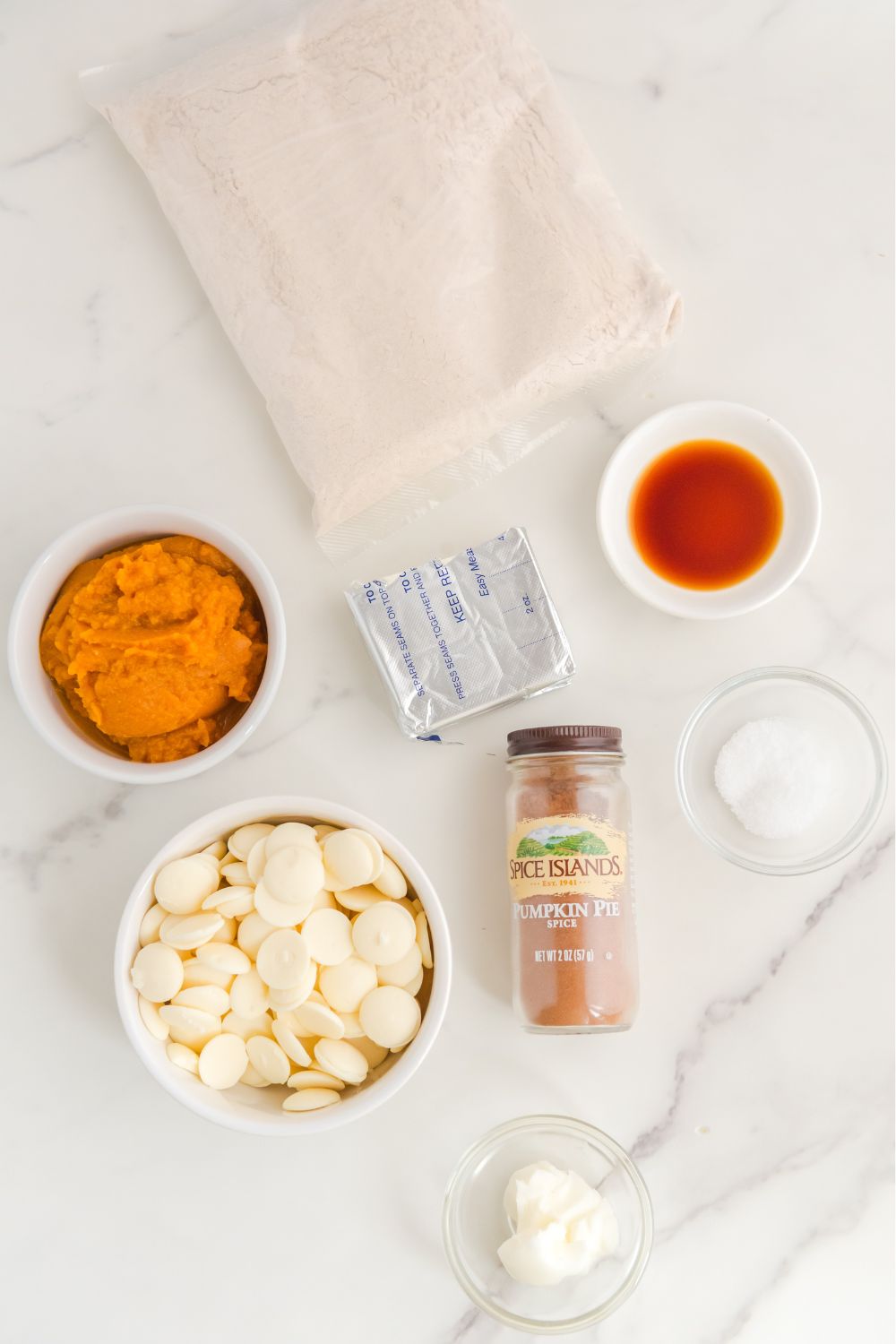 pumpkin spice cheescake ball ingredients on marble counter