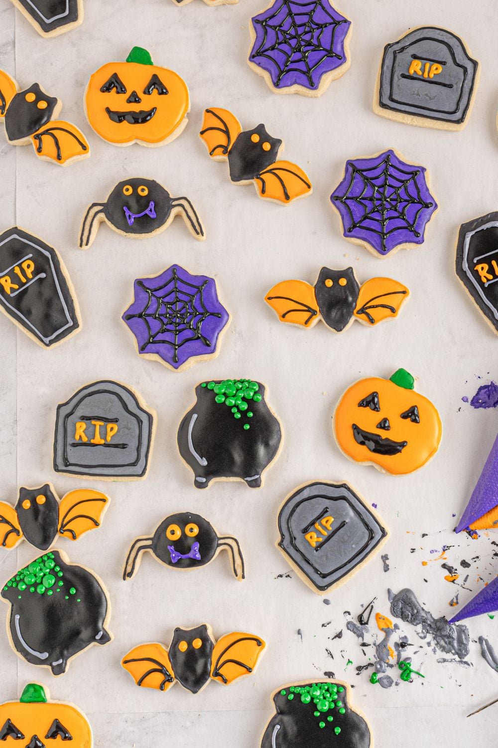 sugar cookies scattered on table for Halloween
