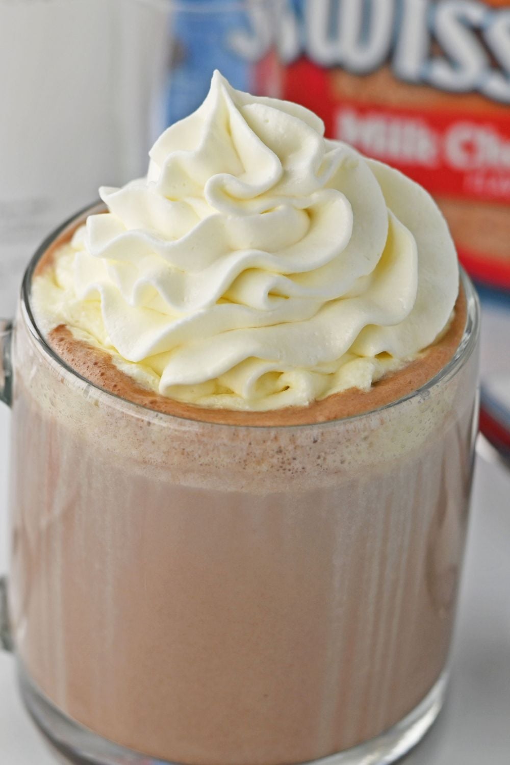rumchata and hot choclate in glass topped with whipped cream