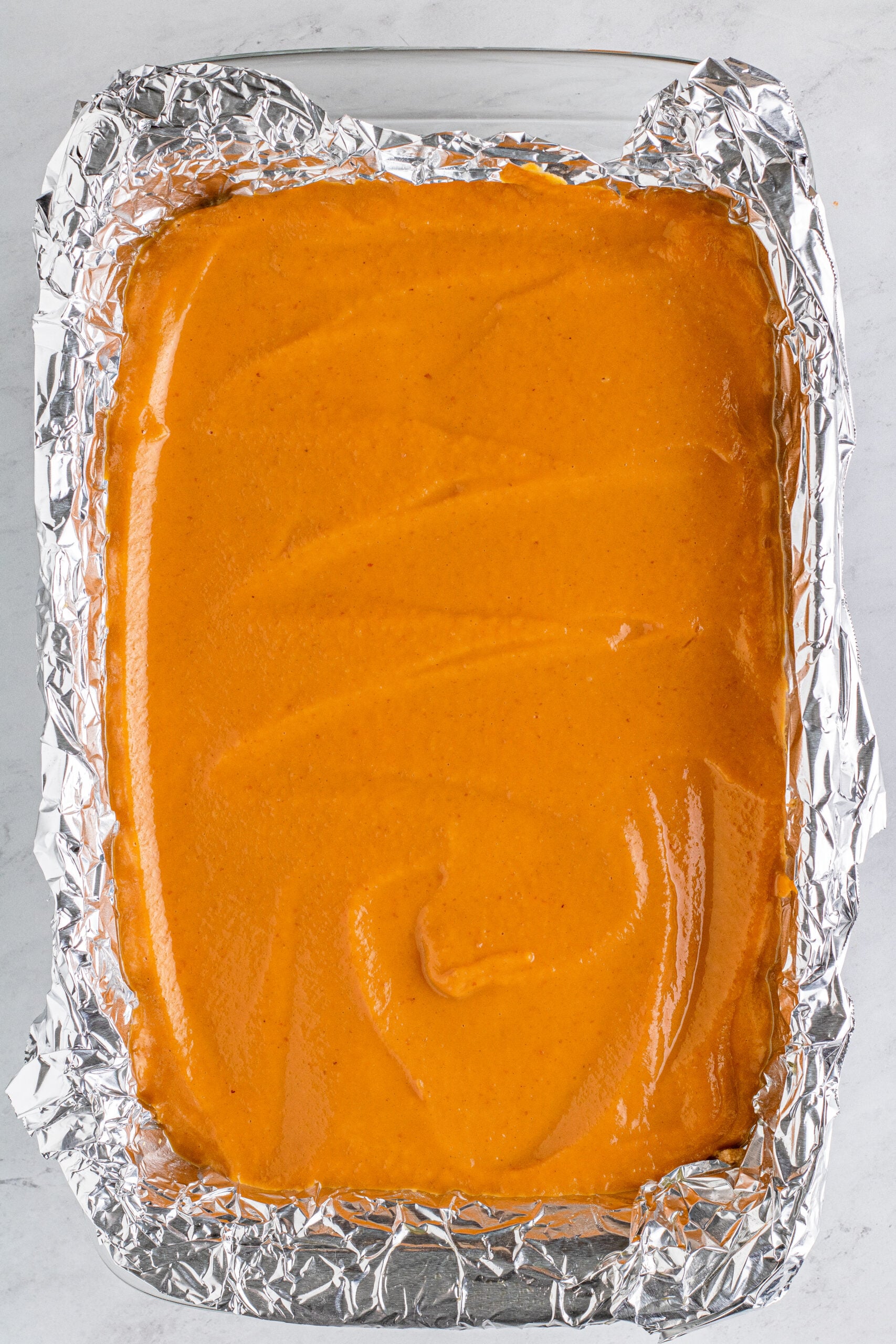 pumpkin batter spread in pan