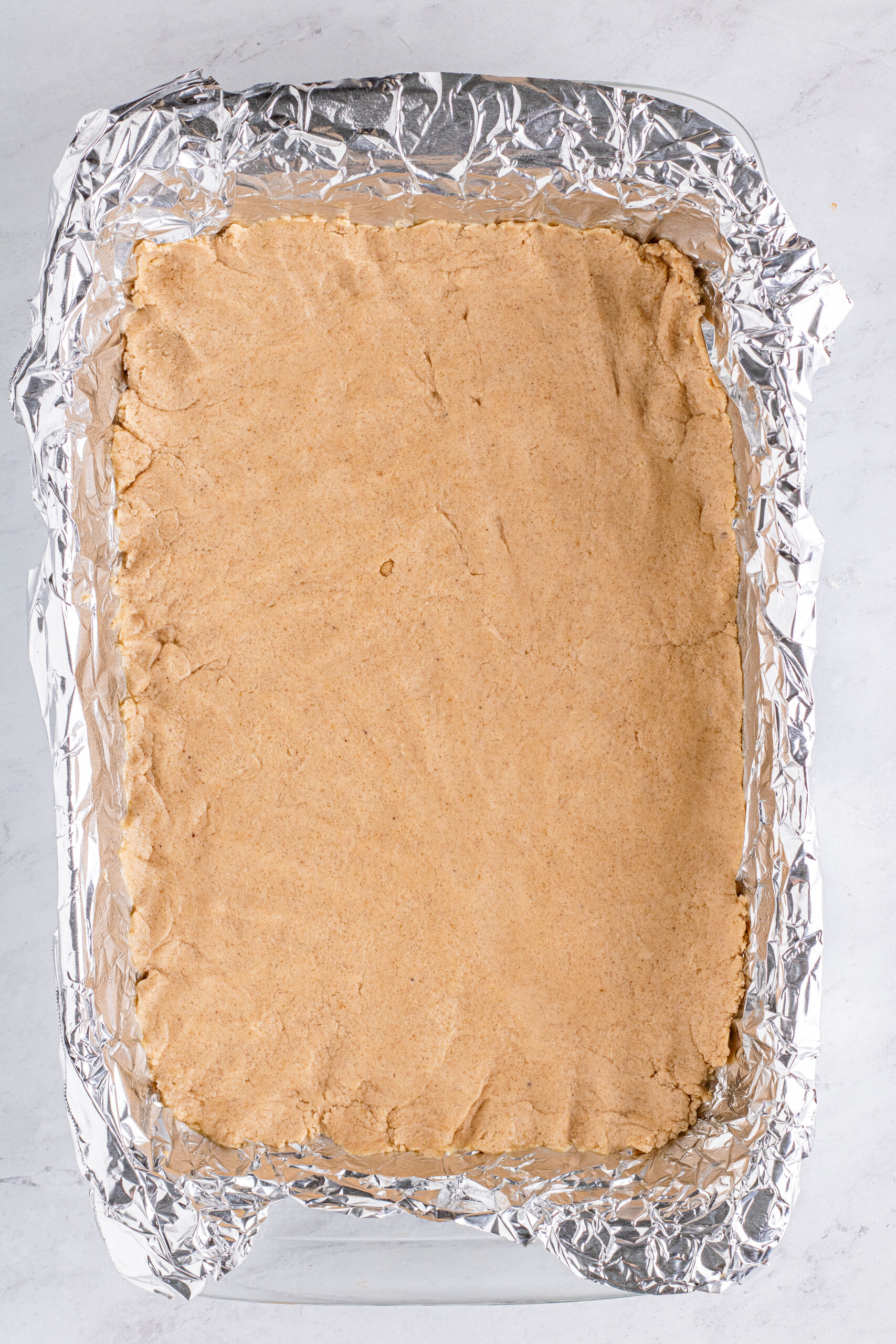 crust for pumpkin bars in table with foil