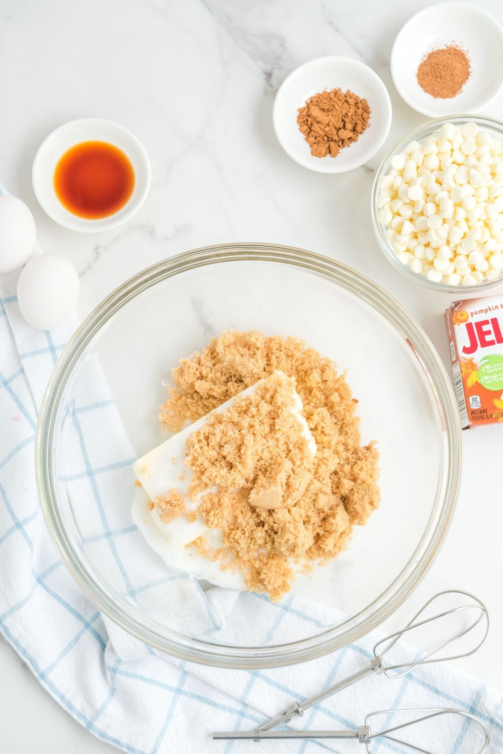 butter and sugar in a glass mixing bowl