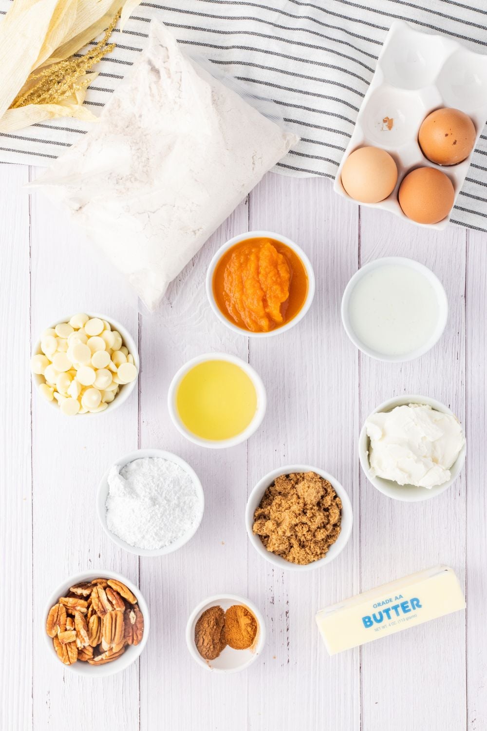 cake mix ingredients in small bowls on white counter