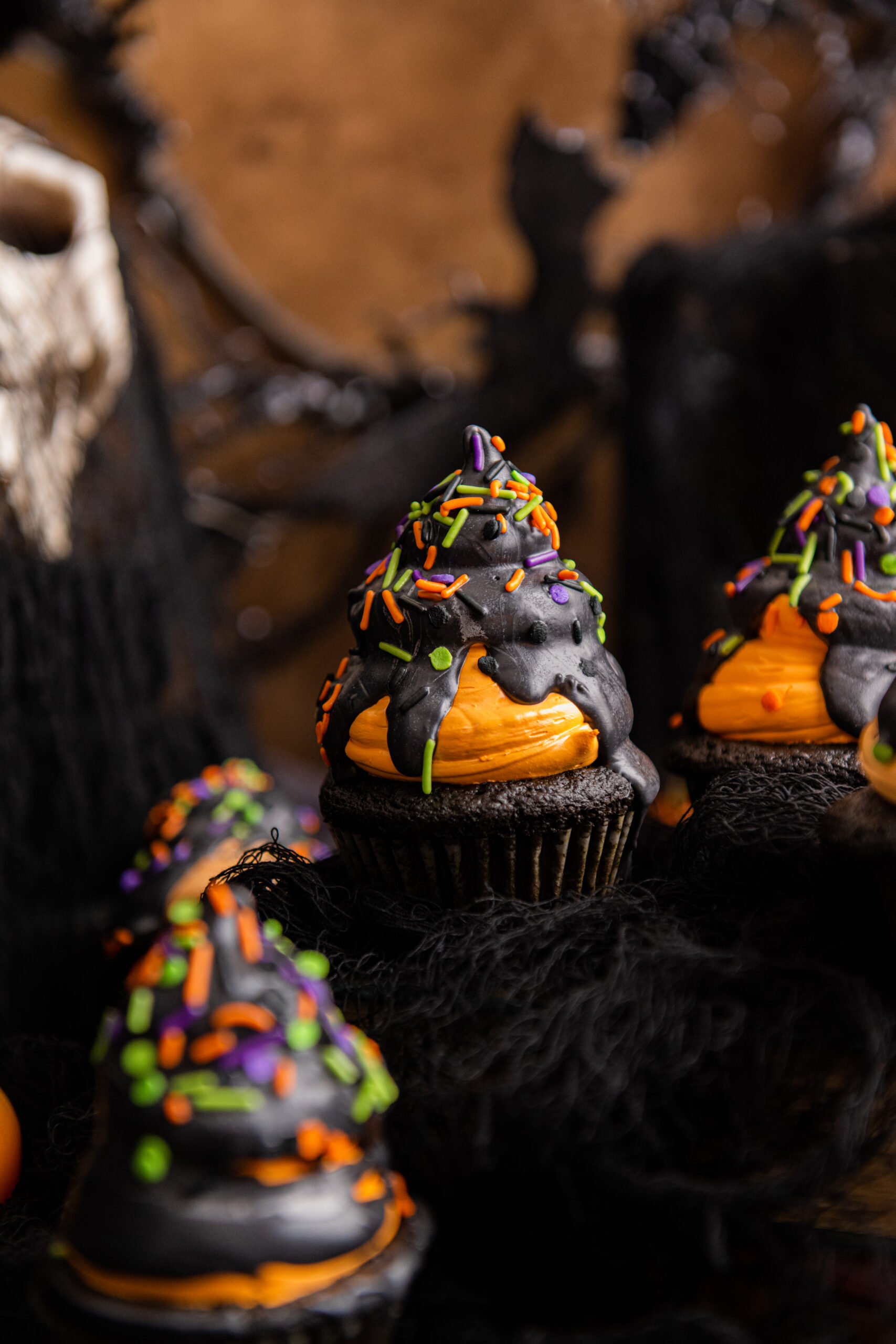Halloween Cupcakes topped with black chocolate and sprinkles