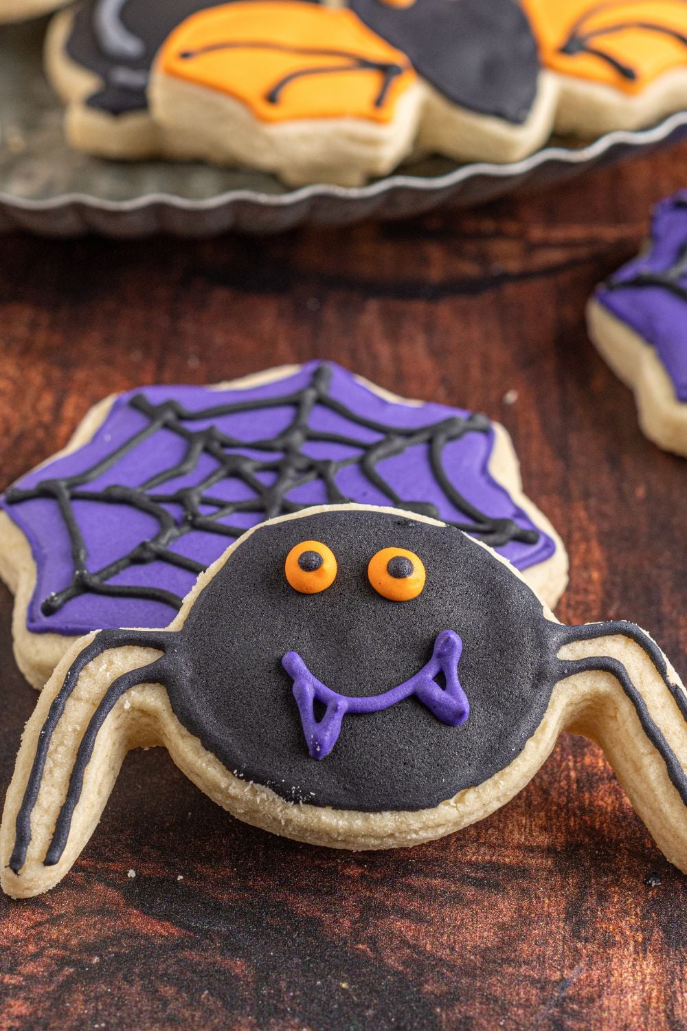 spider and spiderweb cookie on table
