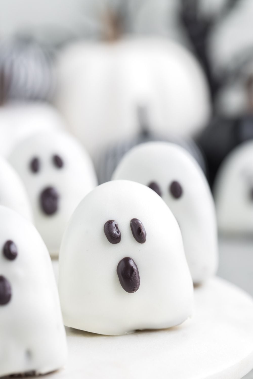 spooky ghost oreo truffles on table spread out