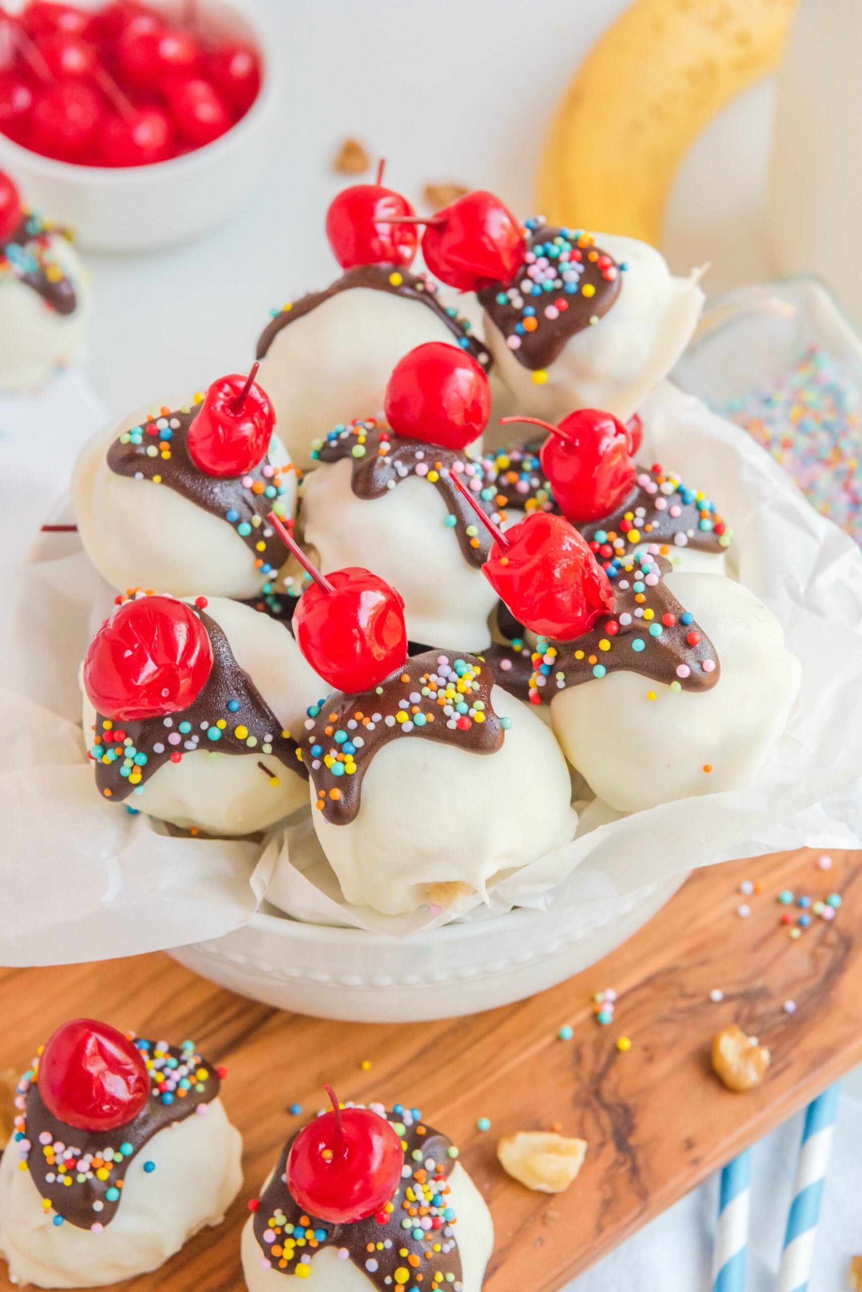 Overhead view of Banana Truffles surrounded by cherries, nuts, and bananas.