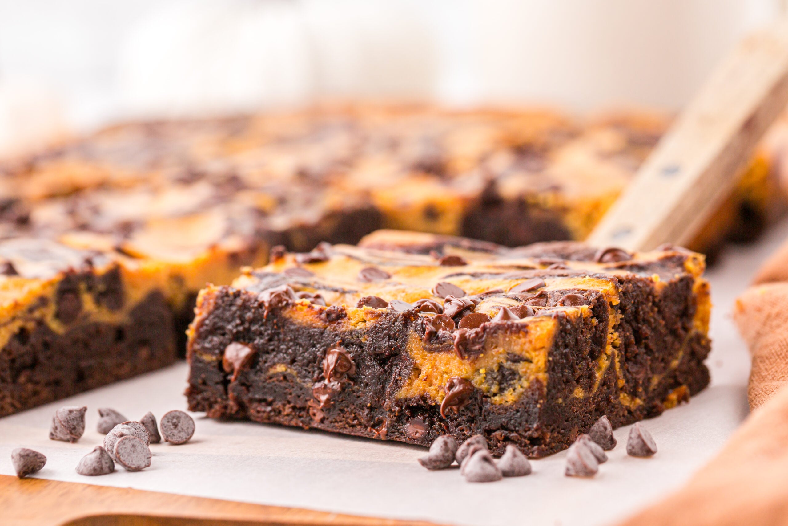 Easy Pumpkin Brownie on a wood cutting board