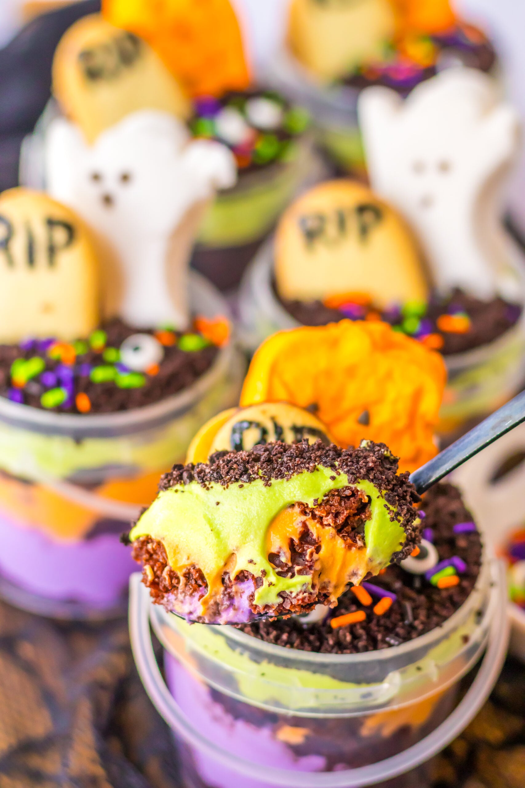 spoon with halloween pudding cup mixture on it