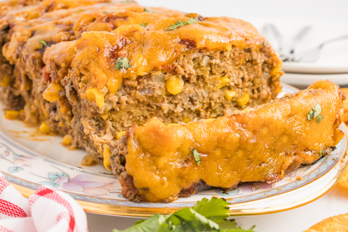 meatloaf sliced and placed on a platter on table