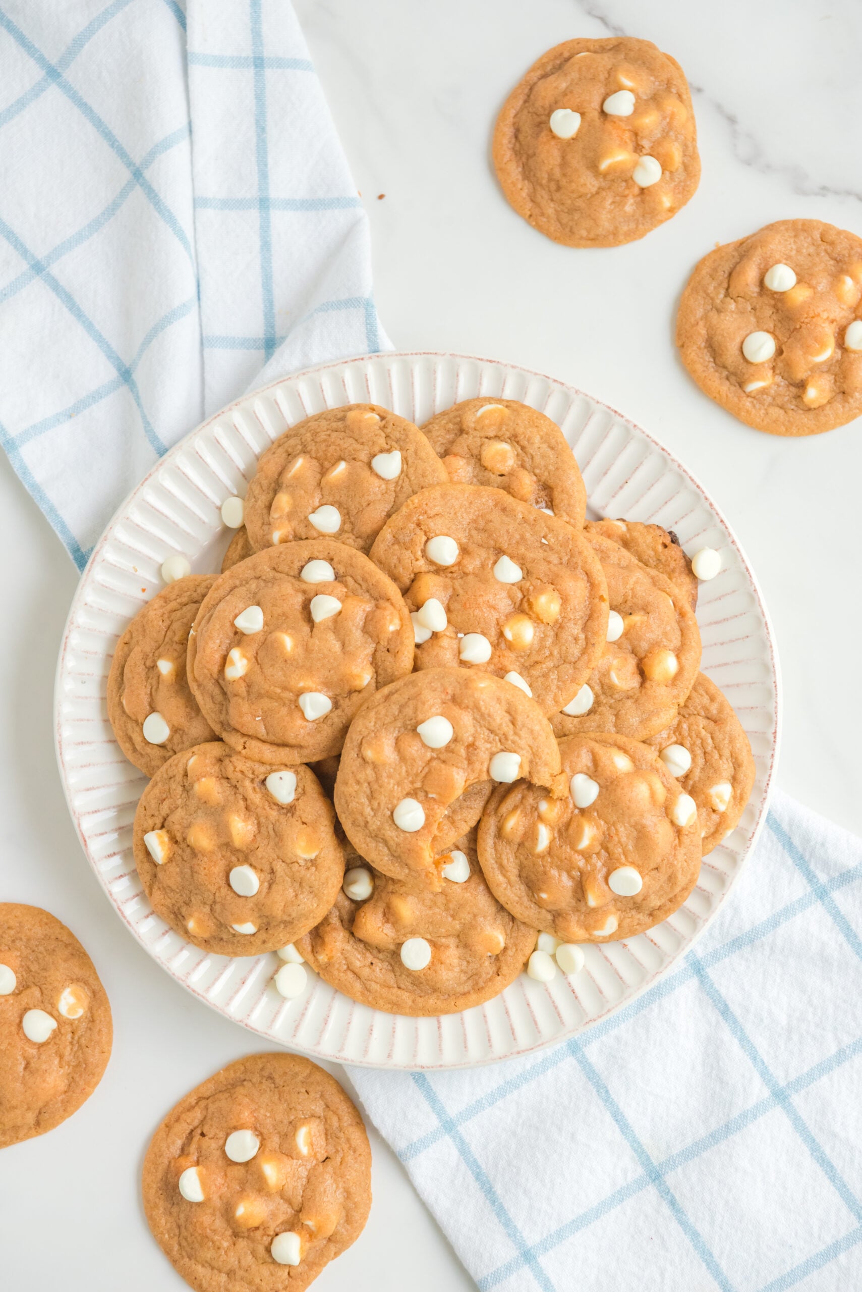overhead shot of a pile of Pumpkin Spice Pudding Cookies on a white plate