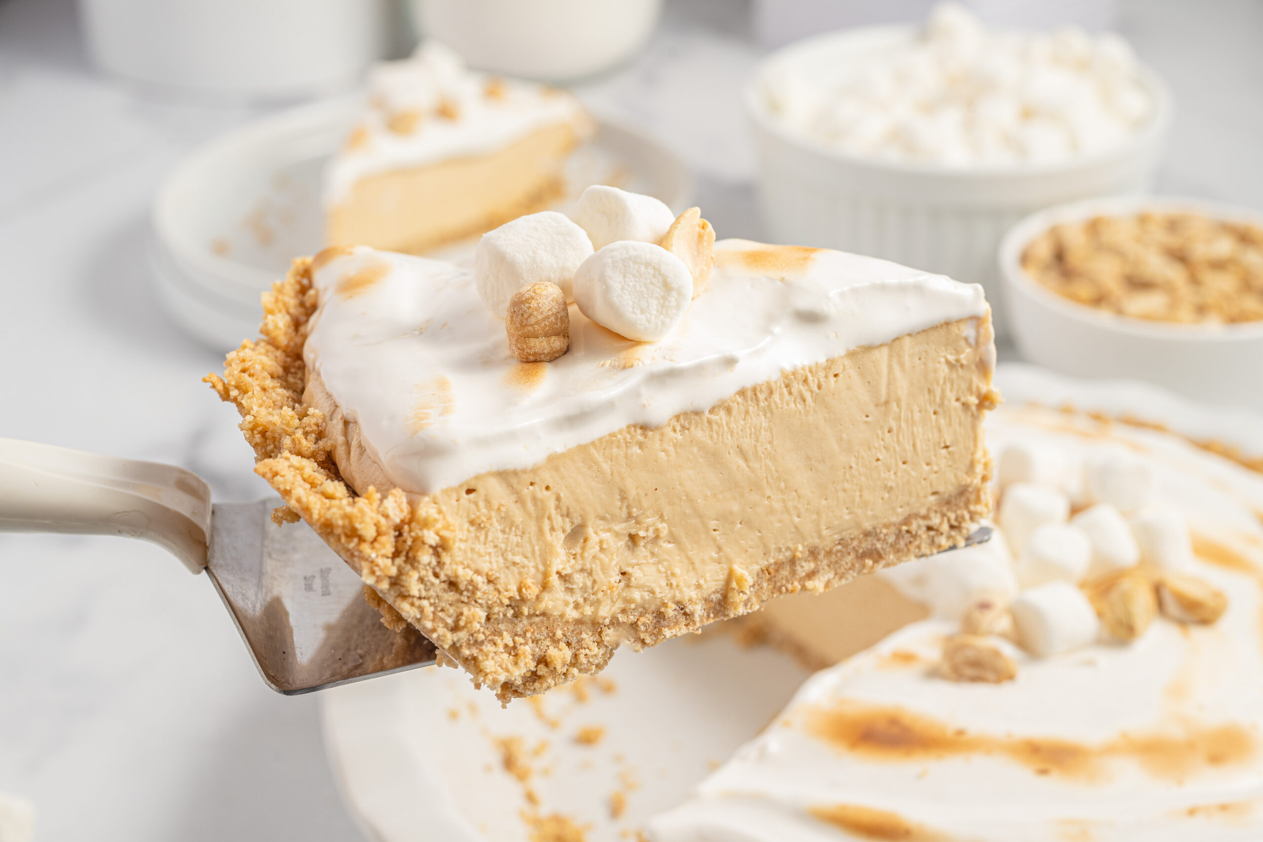 slice of the fluffernutter pie being lifted up out of the pie dish
