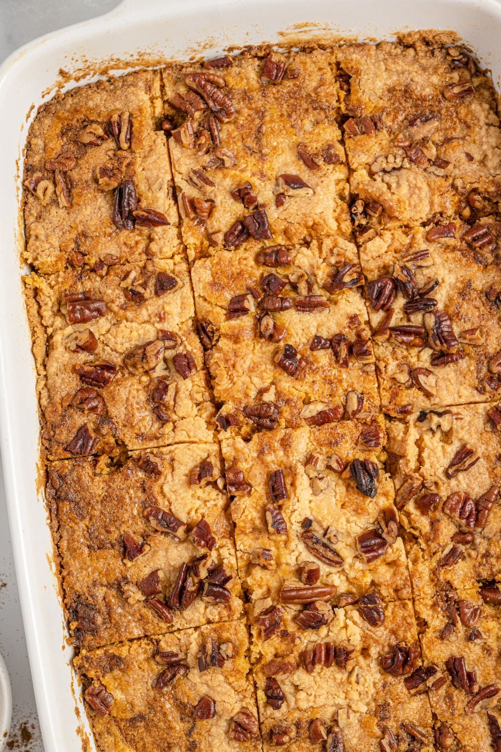 overhead view of cake in pan with slices made