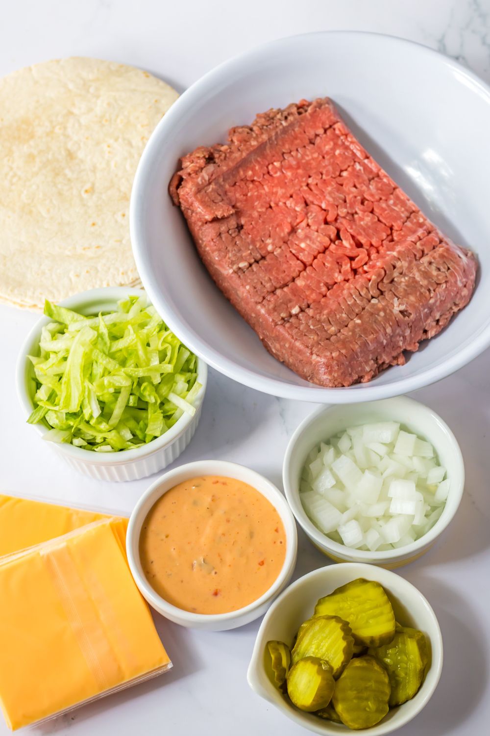 ingredients for big mac tacos on table