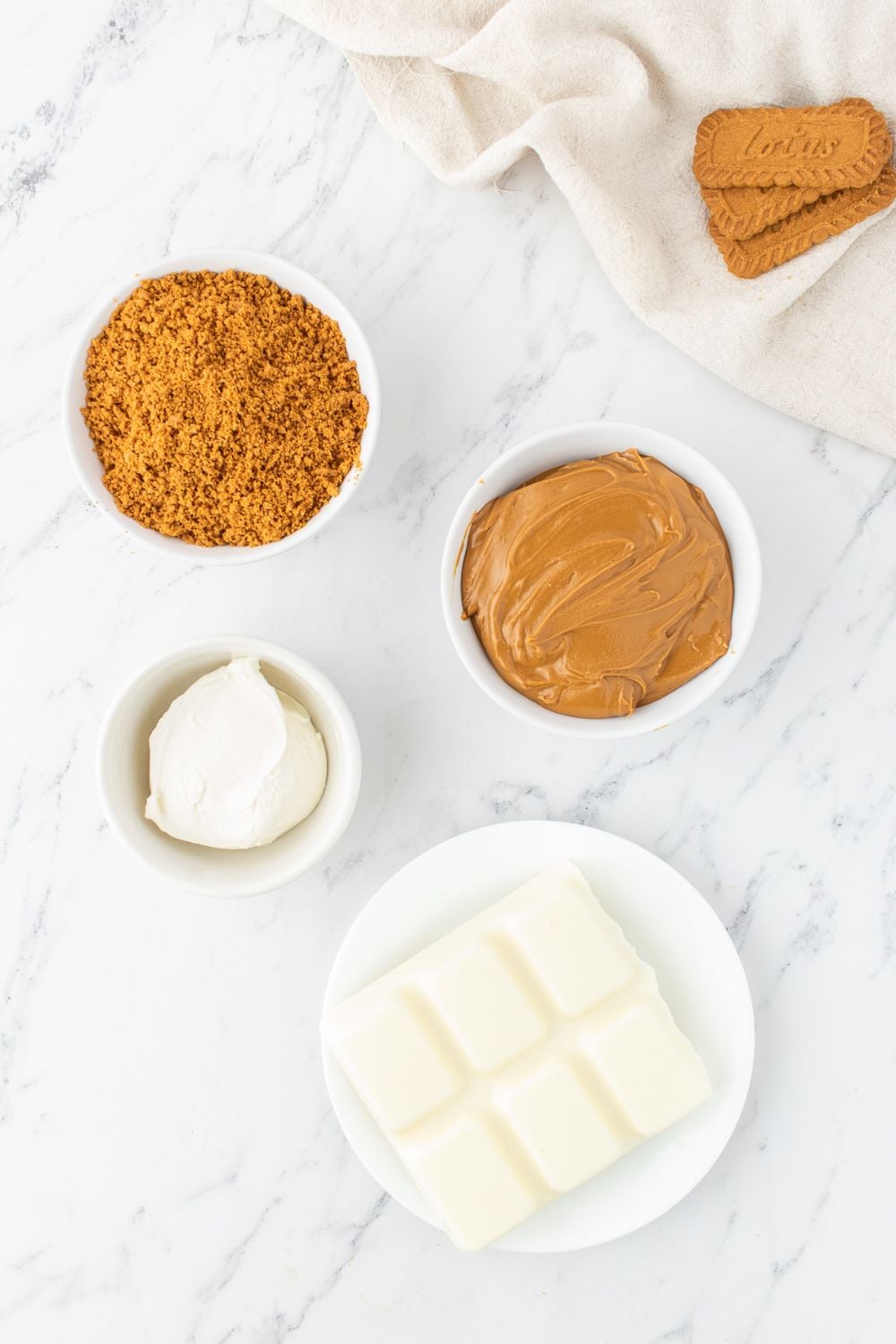 ingredients for biscoff cookie truffles on a marble table