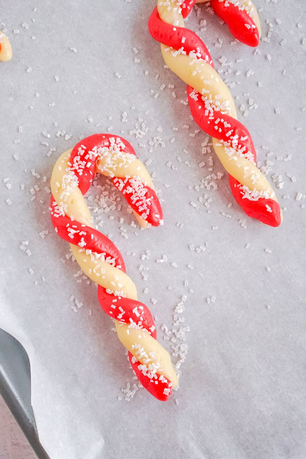 twisting sugar cookie candy canes on table